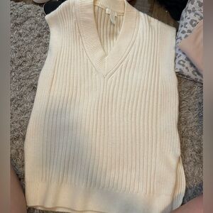 Size xs cream sweater vest. can fit like a small or medium. never worn. no tags